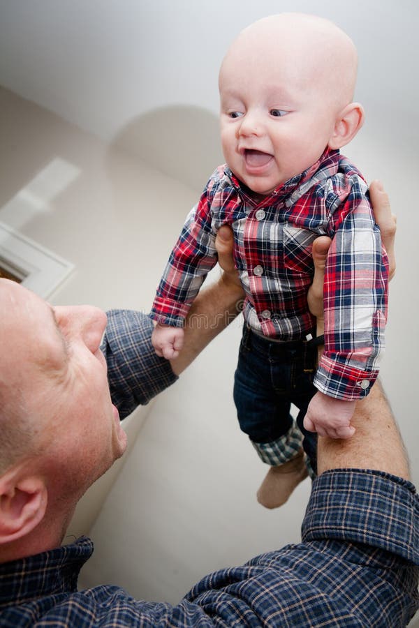 Father Holding Son in the Air Stock Photo - Image of child, happiness
