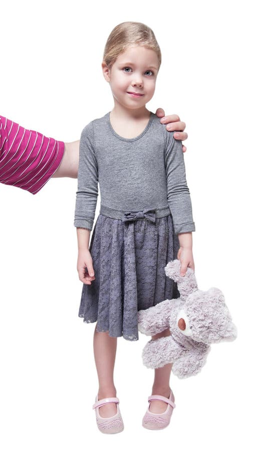 Father hugs his little daughter holding teddy bear isolated stock photo Father hugs his little daughter holding teddy bear isolated stock photo