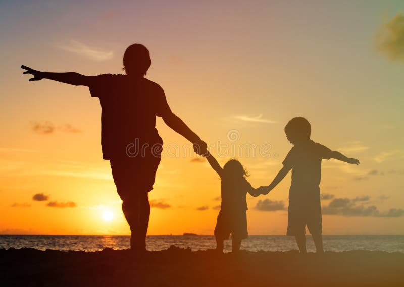 Father with kids silhouettes having fun at sunset royalty free stock photos Father with kids silhouettes having fun at sunset royalty free stock photos