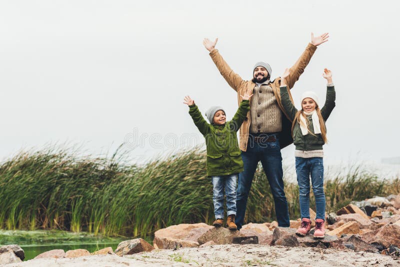 father and kids wih raised hands outdoors royalty free stock photos father and kids wih raised hands outdoors royalty free stock photos