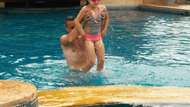 The Father with Little Daughter Have Fun in the Pool. Dad Plays with the Child Stock Video - Video of family, cooking: 214816427