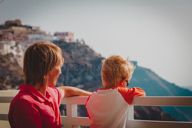 Father and little son looking at caldera in Santorini, Greece royalty free stock images Father and little son looking at caldera in Santorini, Greece royalty free stock images