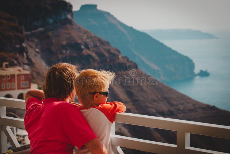 Father and little son looking at caldera in Santorini, Greece royalty free stock photo Father and little son looking at caldera in Santorini, Greece royalty free stock photo