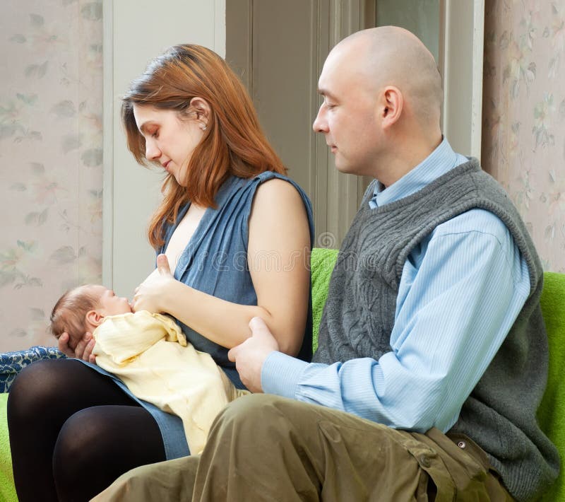 2schoolgirls Suking Video - Father Looks at the Baby Sucking Breast of Mother Stock Photo - Image of  female, little: 27937168