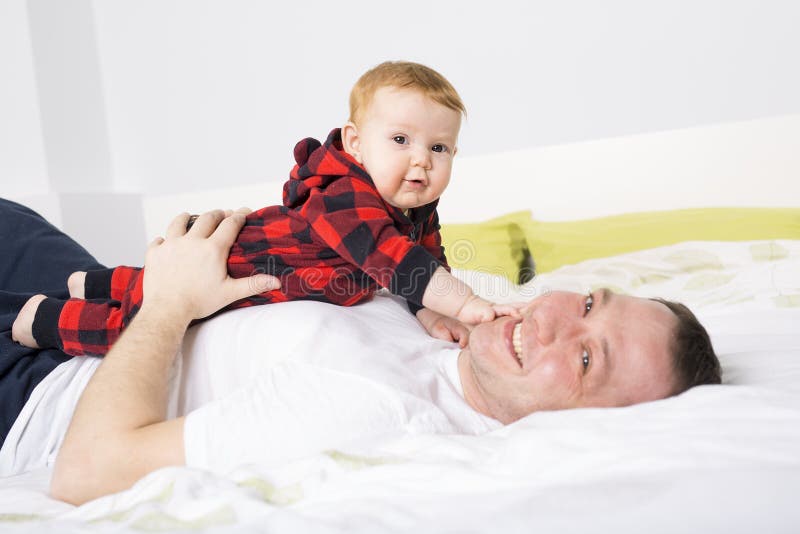 Father Playing with Baby Girl Lay on Bed Stock Image Image of