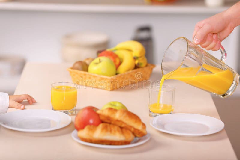 Father Pours Orange Juice Into The Glass Stock Image - Image of closeup, parents: 61974263