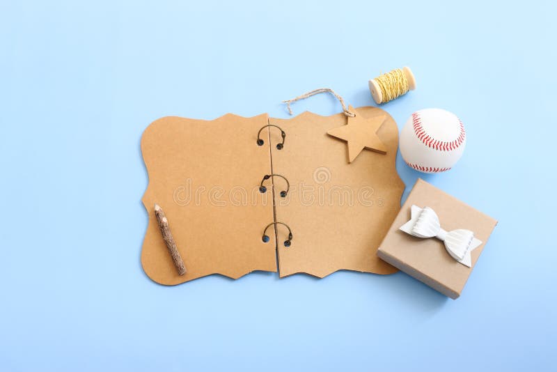 Father's day concept. present box and empty notebook over blue background. top view, flat lay stock image