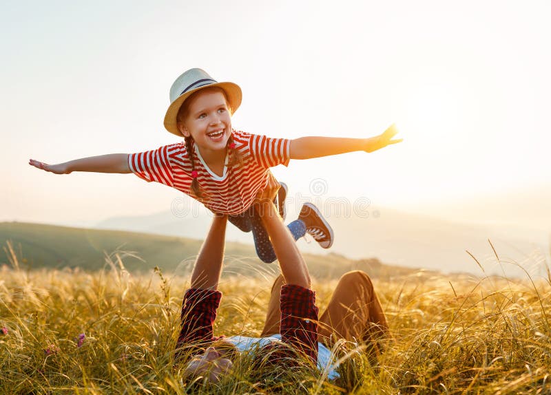 Father`s day. Happy family father and child daughter playing and laughing on nature