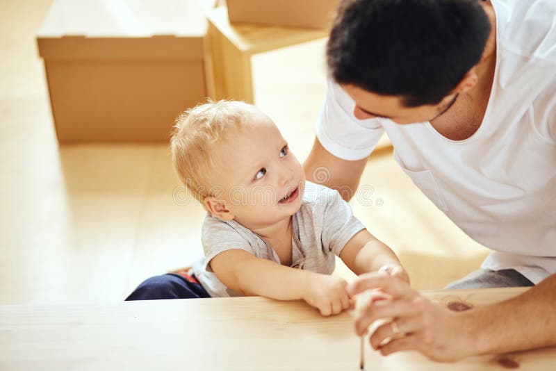 Father and Son Assembling Furniture at Home Stock Image Image of