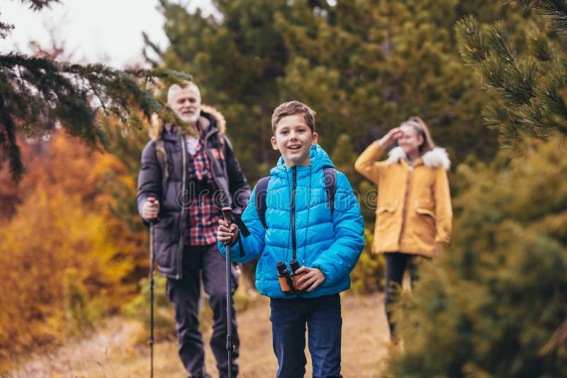 Father with son and daughter hiking in nature stock images