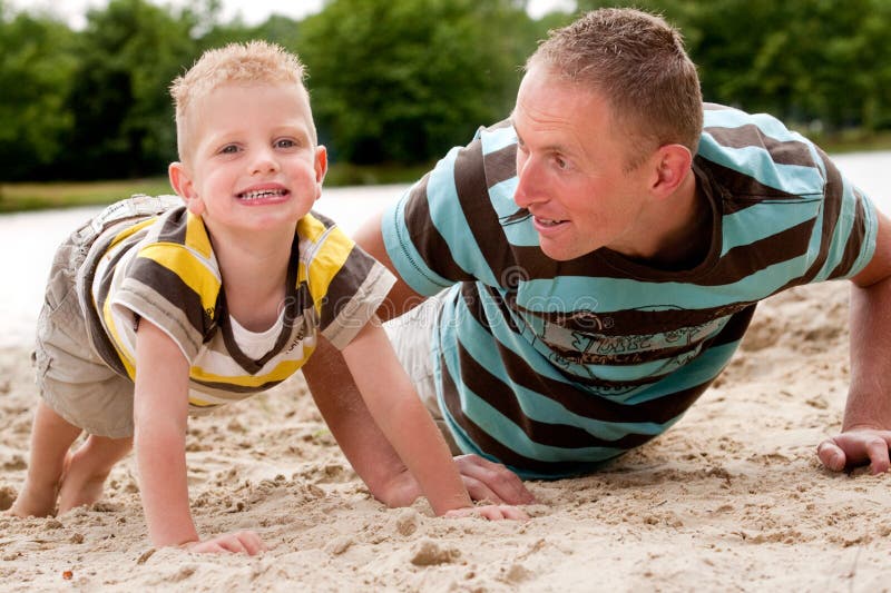 Father and son doing push-ups