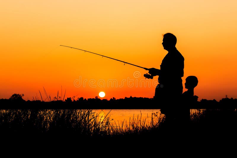 Father and son fishing in the river