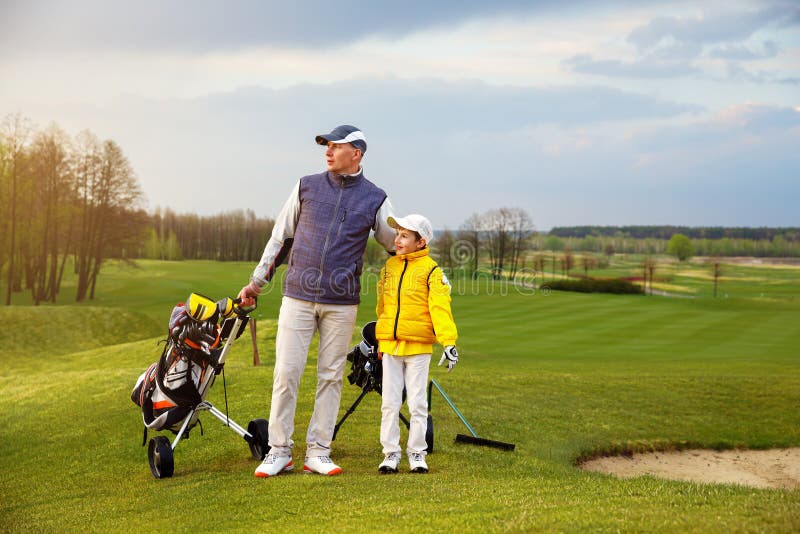 Father with son at golf stock photo. Image of grass, play 61715338