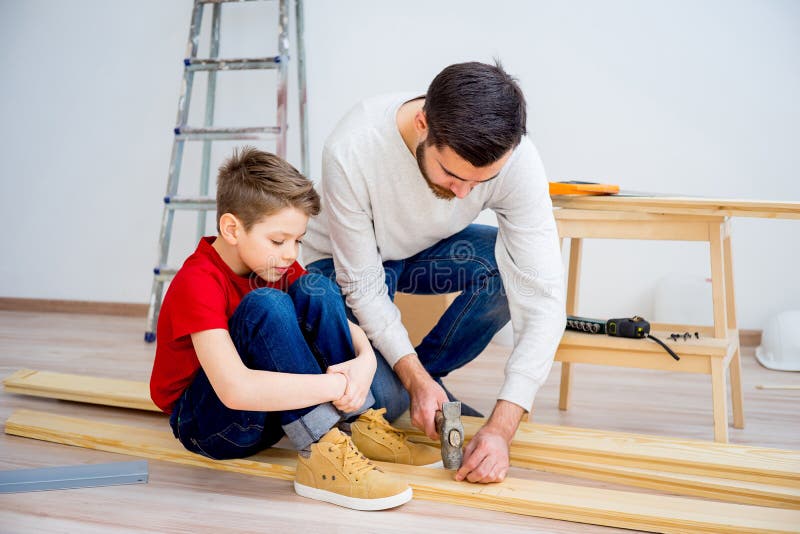 Father and Son Hammering Nails Stock Image Image of board
