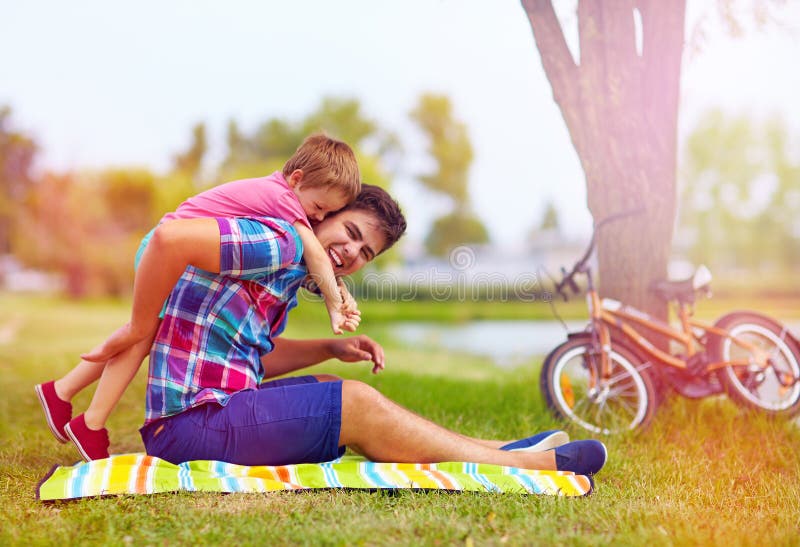Father and son having fun in city park royalty free stock photo Father and son having fun in city park royalty free stock photo