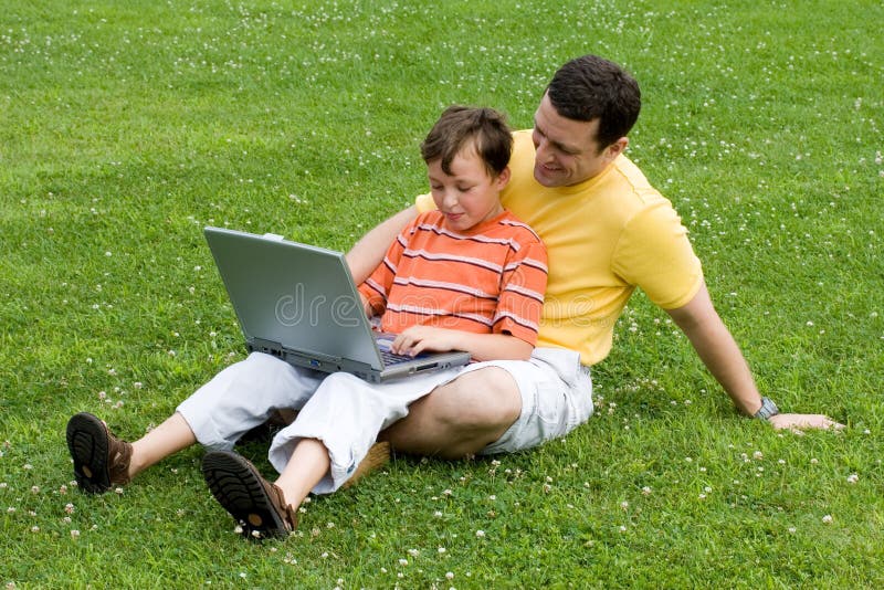 Father and son with laptop