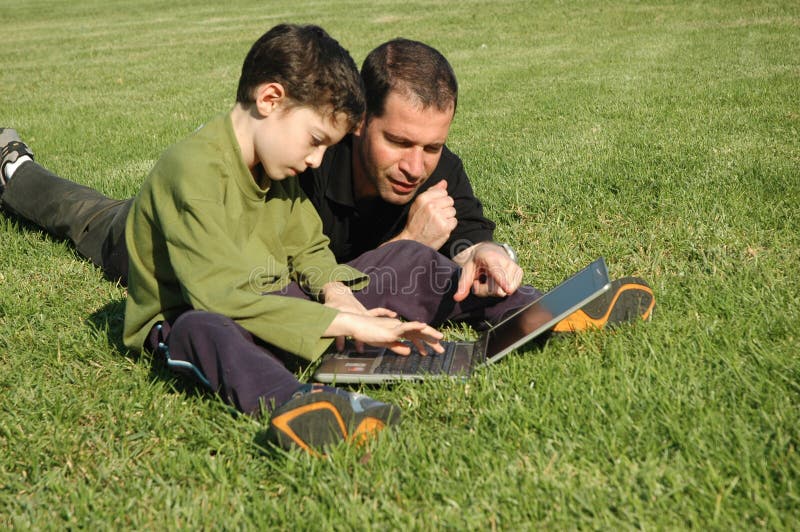 Father and son with laptop