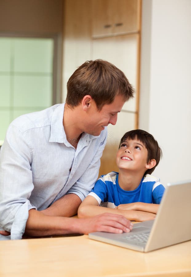 Father and son with laptop