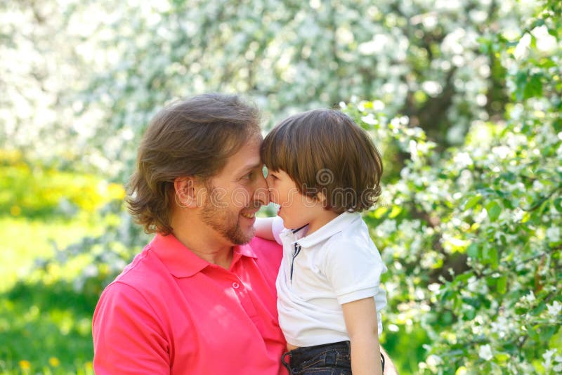 Father and son look at each other royalty free stock photography Father and son look at each other royalty free stock photography