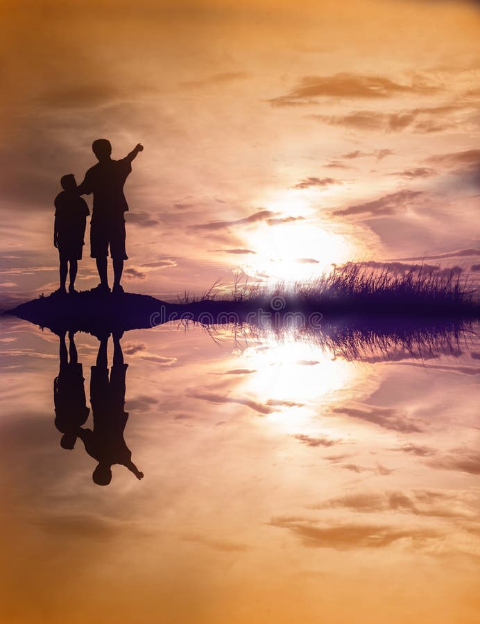 Father and son looking for future with water reflection , silho