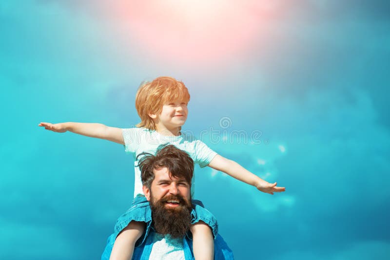 Father and son playing together. Child sits on the shoulders of his father. Family Time. royalty free stock image Father and son playing together. Child sits on the shoulders of his father. Family Time. royalty free stock image