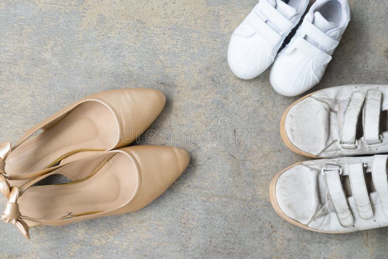 Father And Son Shoes And Mother Gold High Heel Shoes Stock Image ...
