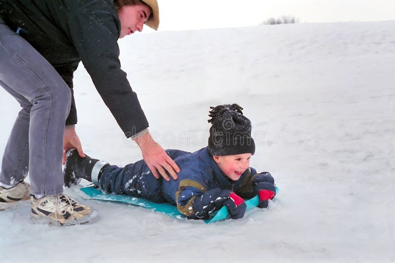 Father and Son Snow Sledding, Ontario Canada Stock Photo Image of