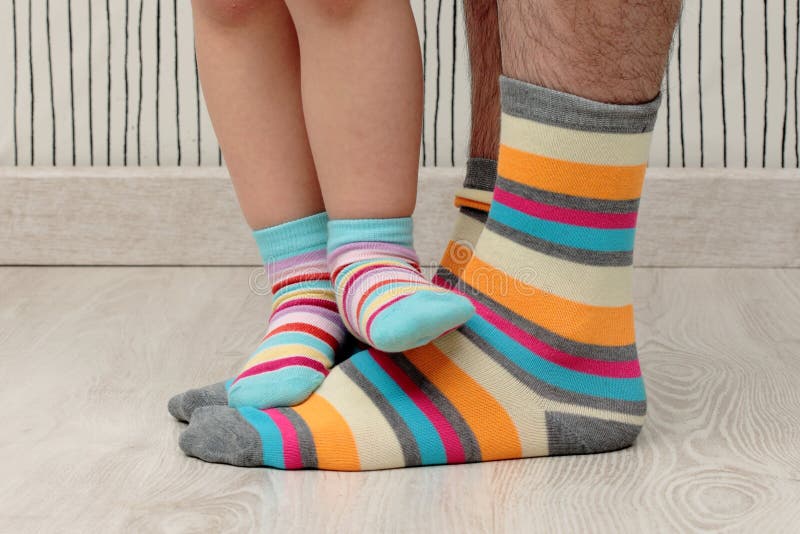 Father and son in socks stock photo. Image of parent 41232684
