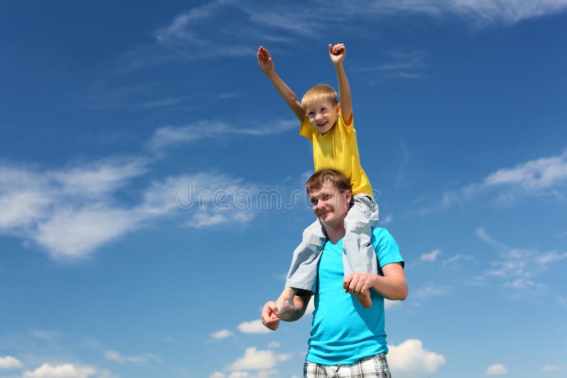 Father with son in summer day outdoors