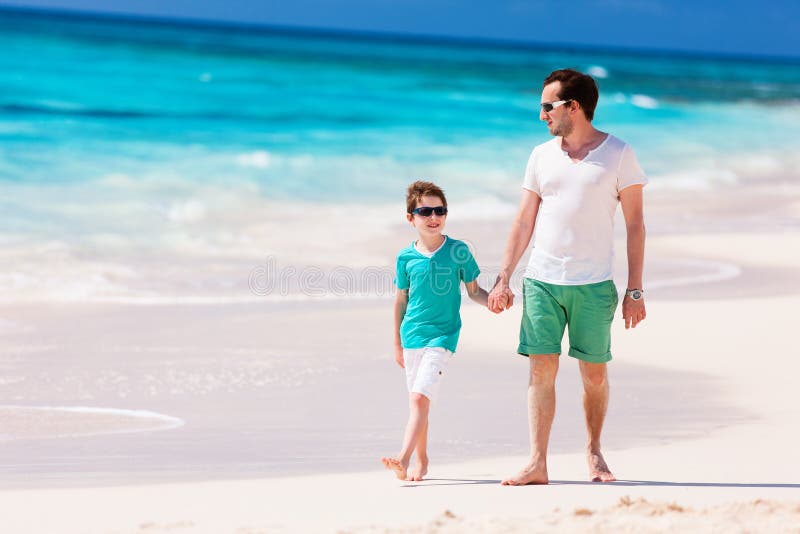 Father and son at beach stock image. Image of parent 25219821