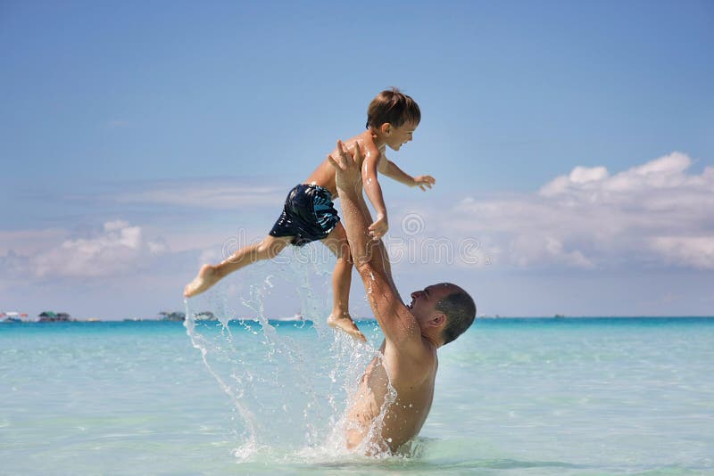 Father and son in water