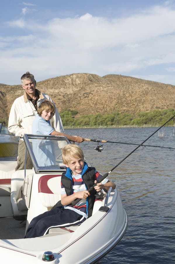 Father And Sons Fishing From A boat