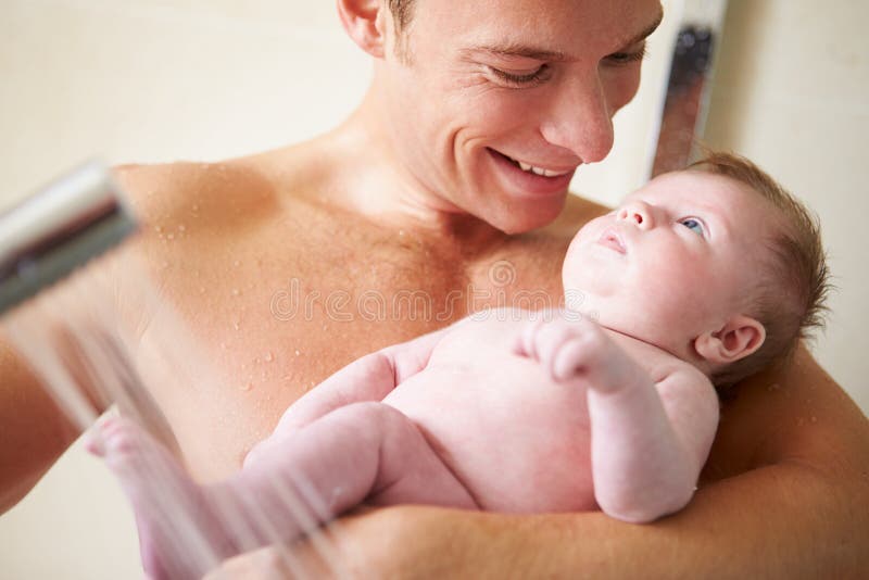 Father Taking Shower With Baby Daughter. 
