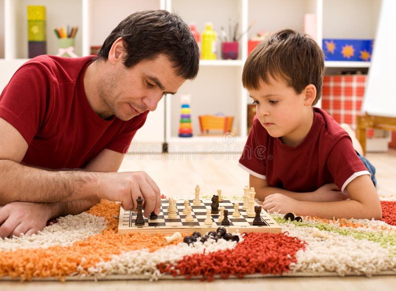 Father Teaching Son The Rules Of Chess Stock Photo Image