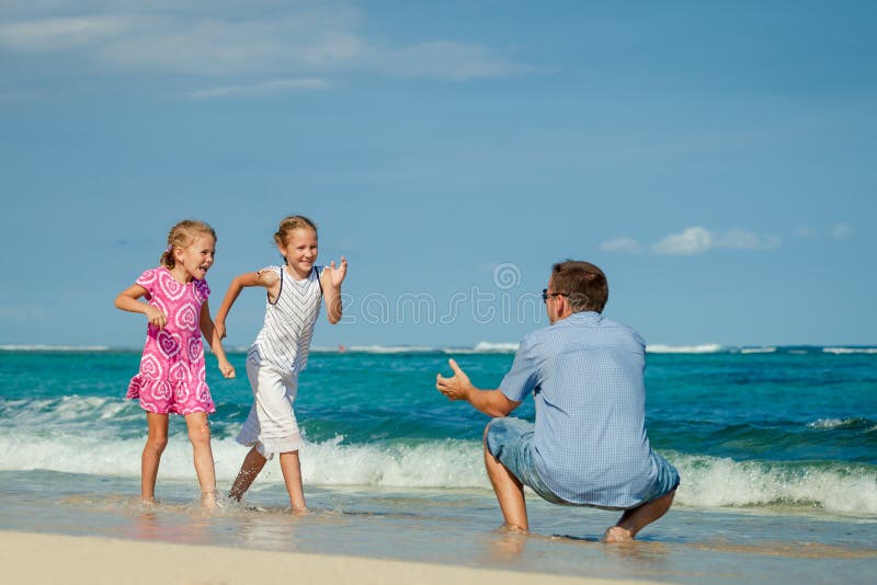 Father and Two Daughters Running on the Beach Stock Image Image of