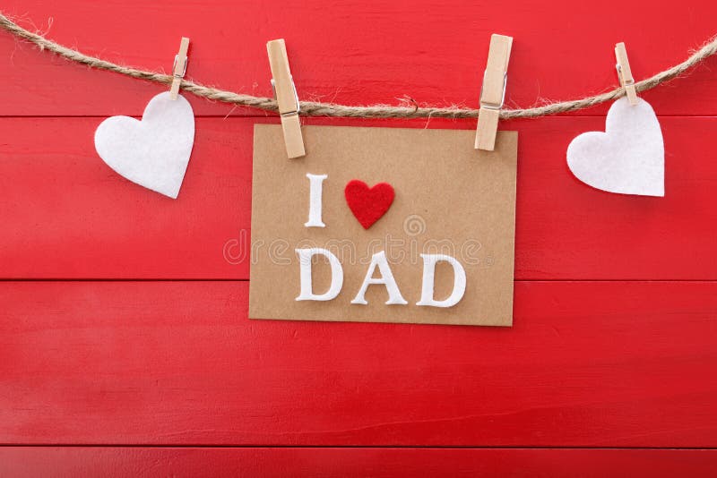 Fathers day message over red wooden board