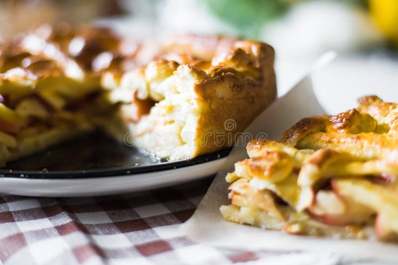 Plate of apple pie with fresh apples. Plate of apple pie with fresh apples