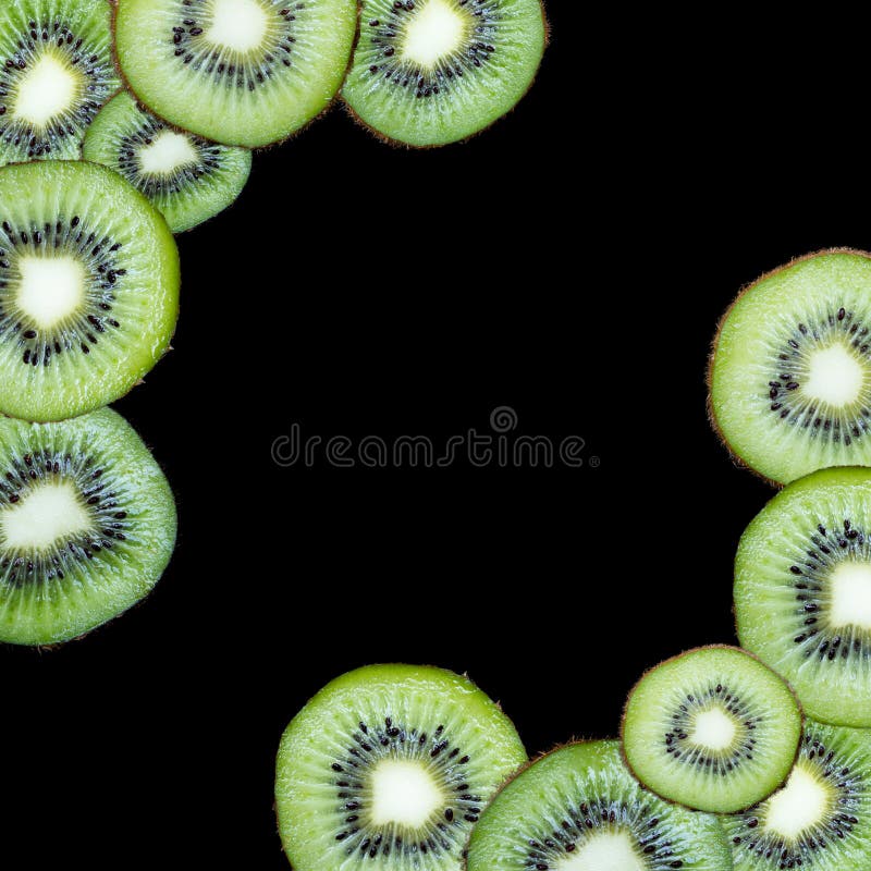 Fatias do fruto em um fundo preto fotografia de stock Fatias do fruto em um fundo preto fotografia de stock