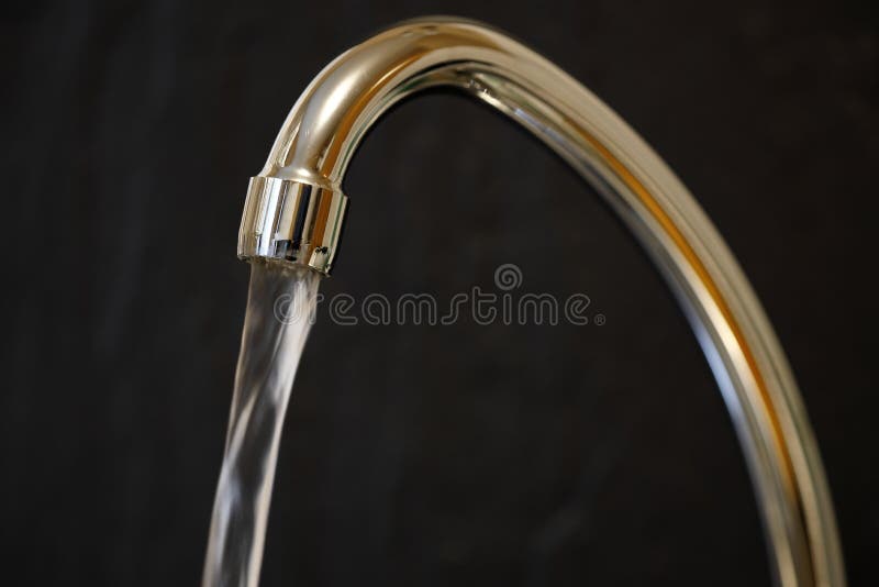 Faucet with running water stock image. Image of waste 140995389