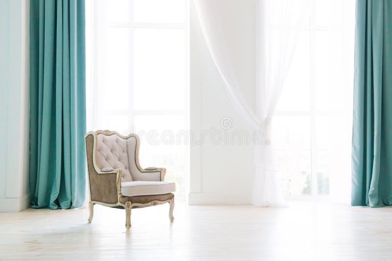 Vintage armchair against white wall and big window with curtain. Space for your copy. Vintage armchair against white wall and big window with curtain. Space for your copy.