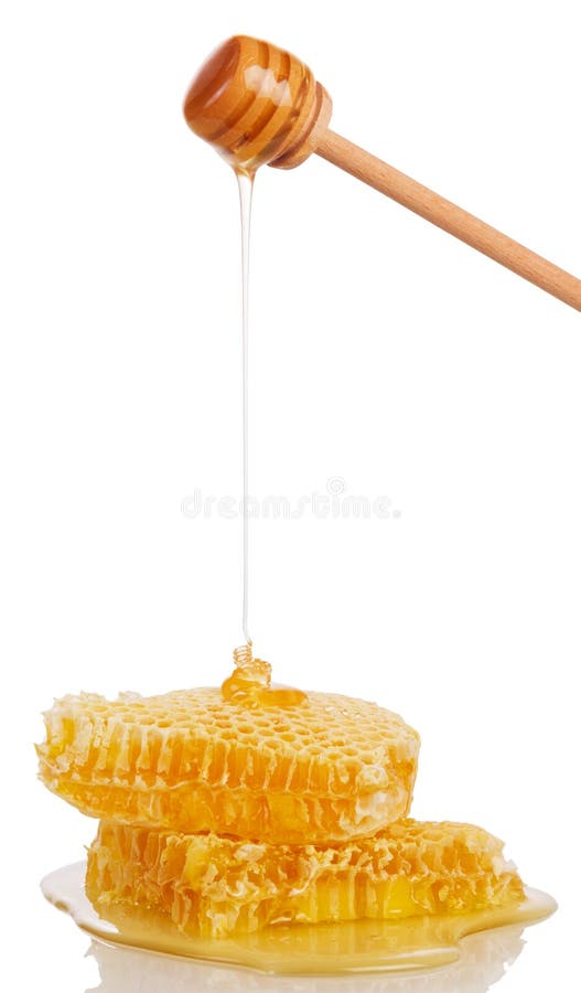 Honeycombs and honey flowing down from the a ladle isolated on a white background. Honeycombs and honey flowing down from the a ladle isolated on a white background.
