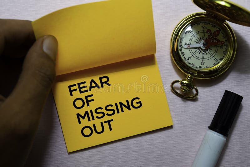 Fear of Missing Out FOMO Text on Sticky Notes Isolated on Office Desk
