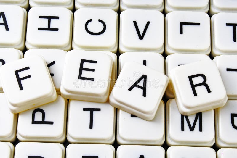Fear text word crossword. Alphabet letter blocks game texture background. White alphabetical cubes blocks letters on royalty free stock photos Fear text word crossword. Alphabet letter blocks game texture background. White alphabetical cubes blocks letters on royalty free stock photos