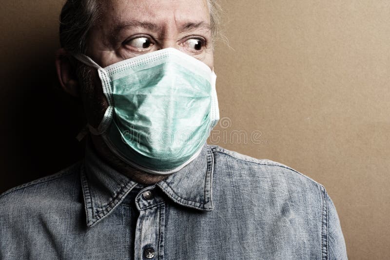 Corona Virus. Fearful man of the contagion virus wears a protective mask