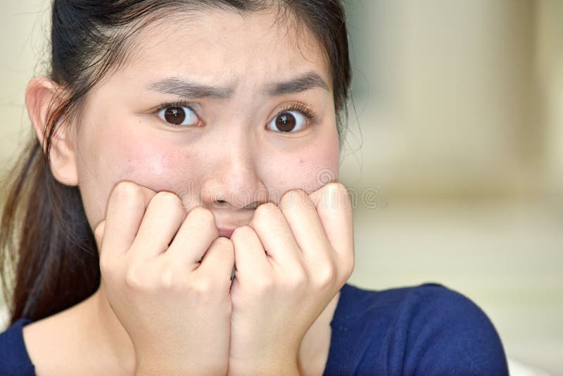 Fearful Youthful Chinese Woman royalty free stock image Fearful Youthful Chinese Woman royalty free stock image