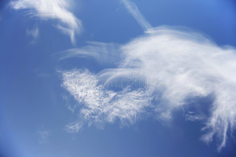 Feather Clouds in the Blue Background of Blue Sky, Closeup Stock Photo