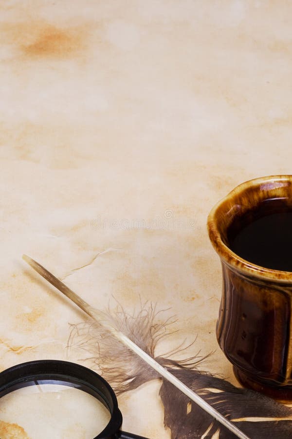 Feather and coffee at table