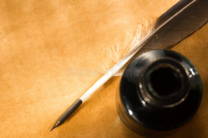 Feather and ink bottle royalty free stock photos