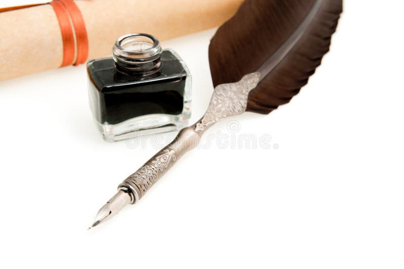 Feather quill ,inkwell and parchment roll