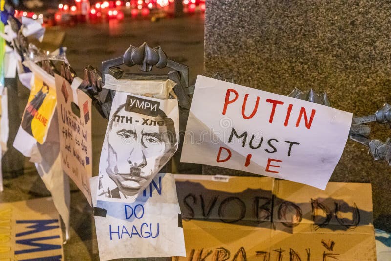 PRAGUE, CZECH REPUBLIC - FEBRUARY 27, 2022: Candles lit on the Wenceslas Square in Prague as a protest against Russian invasion of Ukraine , Czech Republic. PRAGUE, CZECH REPUBLIC - FEBRUARY 27, 2022: Candles lit on the Wenceslas Square in Prague as a protest against Russian invasion of Ukraine , Czech Republic.